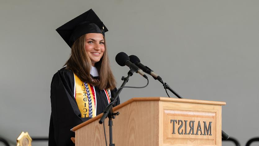 Image of Valedictorian Emma Spiro addressing graduates.